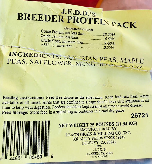 A bag of BREEDER PROTEIN PACK bird feed with product details, brand, and net weight information.